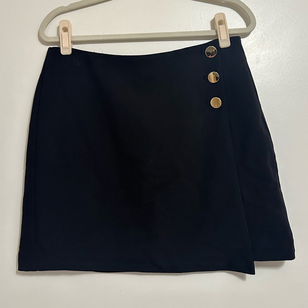Loft black wrap miniskirt with gold buttons.